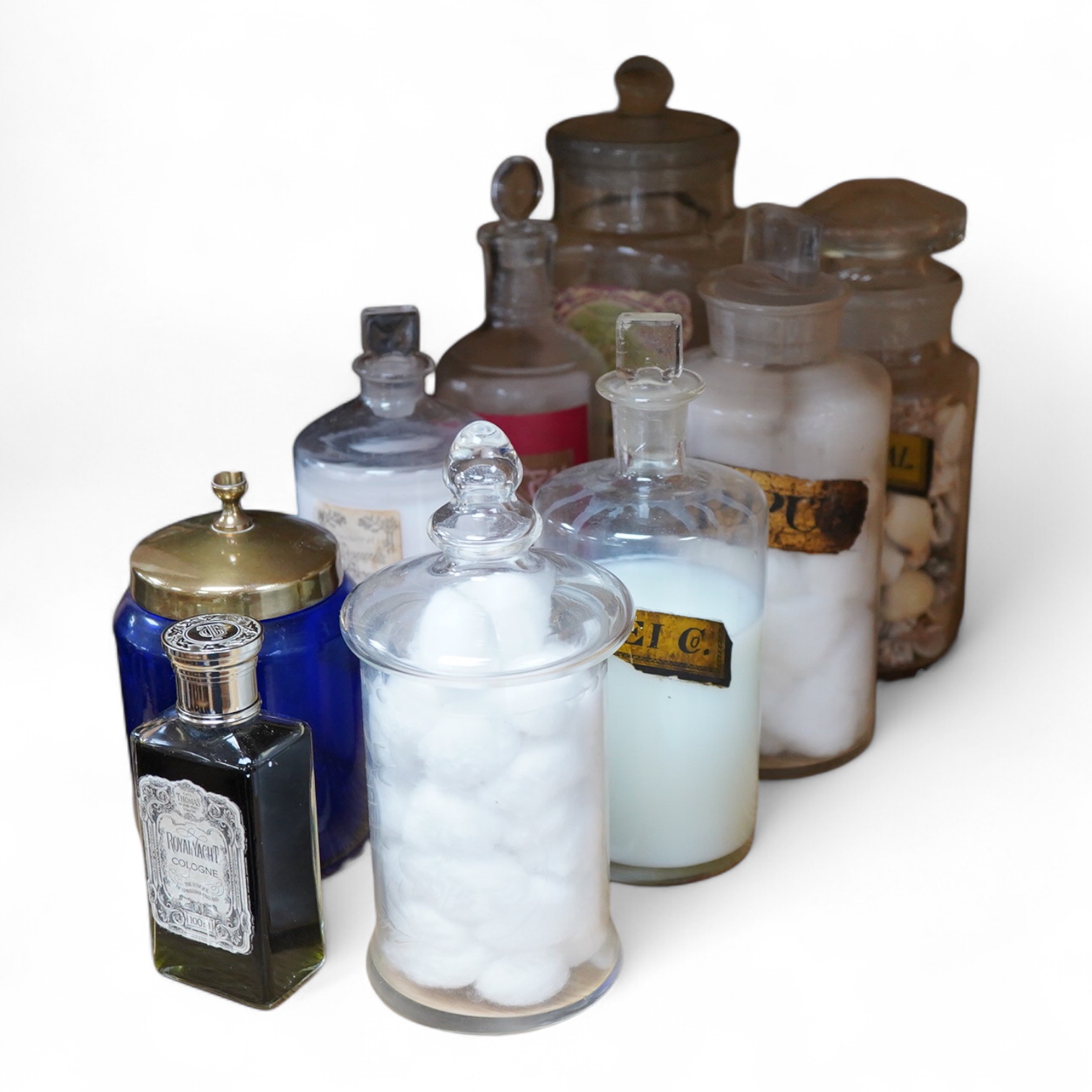 A collection of glass vessels to include Royal Yacht Cologne, three 19th century drug jars etc, (9).